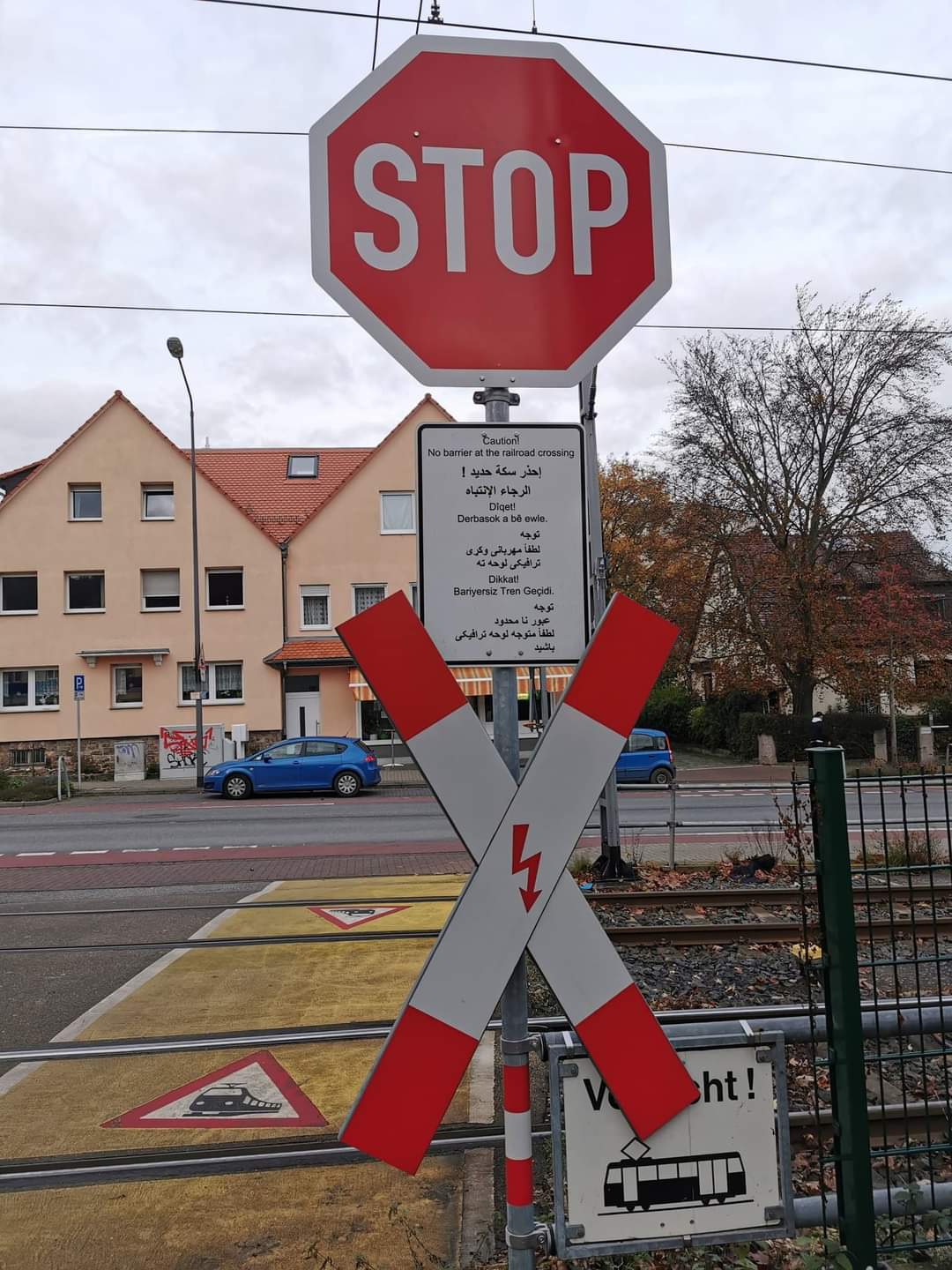 Photo: Traffic signs at a railway crossing (author unknown)