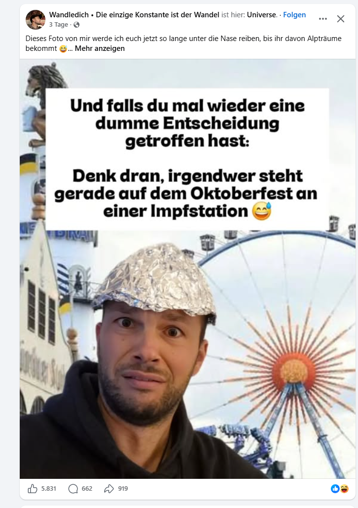 Aluhut vor dem Riesenrad